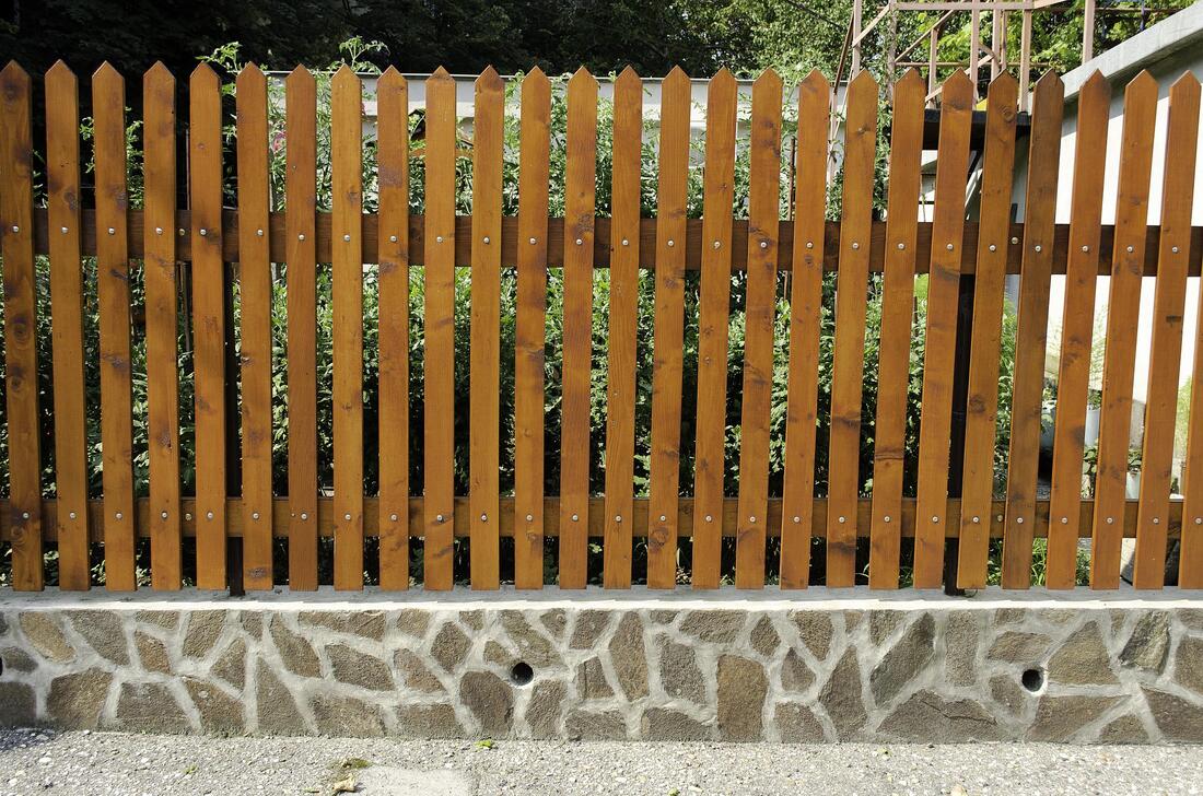 a brown residential fence
